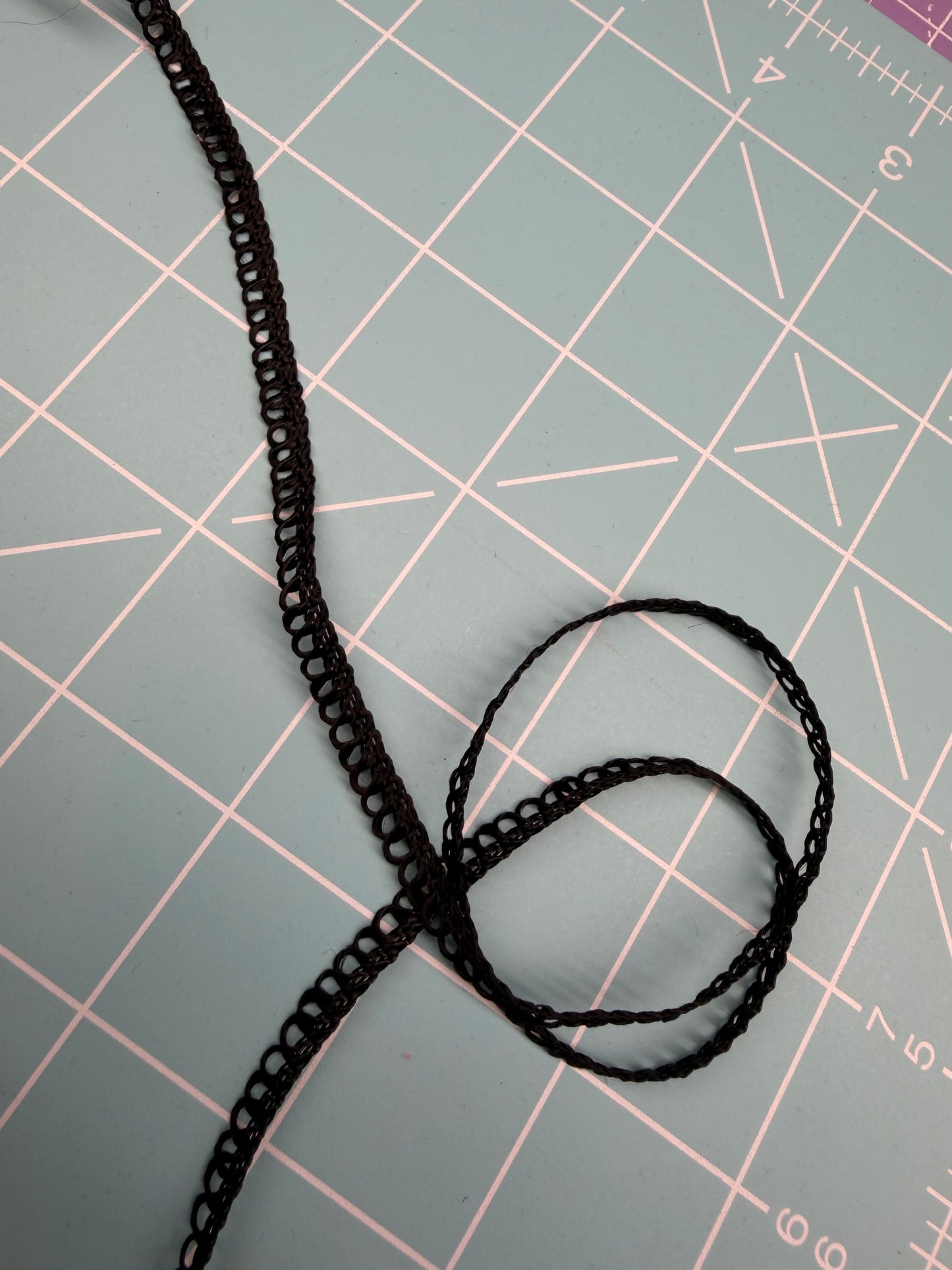 Black picot edge loop trim, featuring a delicate chain-like center and tiny looped edge 1 yard